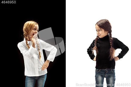 Image of portrait of two emotional girls on a white and black background