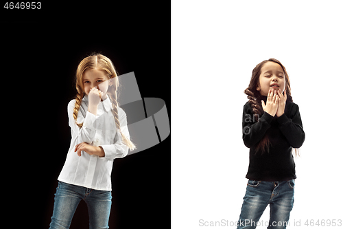 Image of The studio shot of girl is blowing her nose