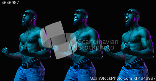 Image of Close up portrait of a young naked african man indoors