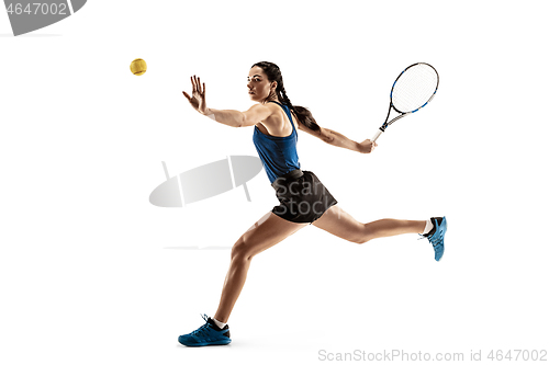 Image of Full length portrait of young woman playing tennis isolated on white background