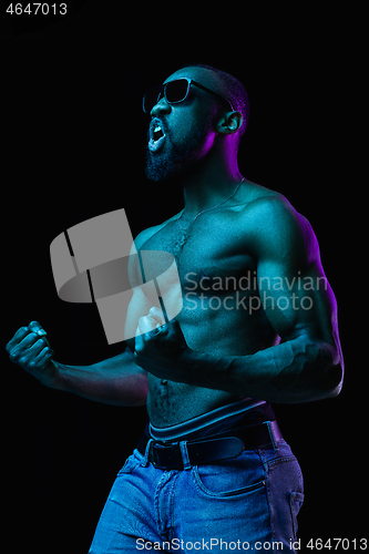 Image of Close up portrait of a young naked african man indoors