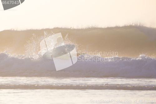 Image of Body surfer riding a perfect wave.