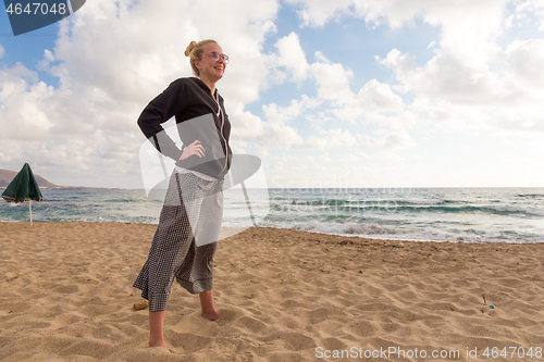 Image of Free Happy Woman Enjoying Sunset on Sandy Beach