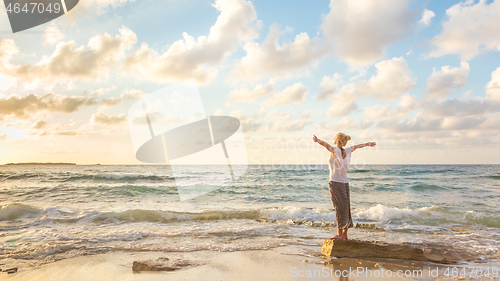 Image of Free Happy Woman Enjoying Sunset on Sandy Beach