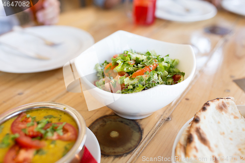 Image of vegetable salad in bowl at indian restaurant