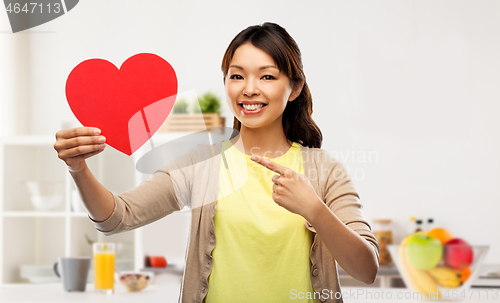 Image of happy asian woman with red heart