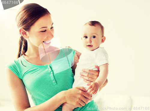Image of happy young mother with little baby at home