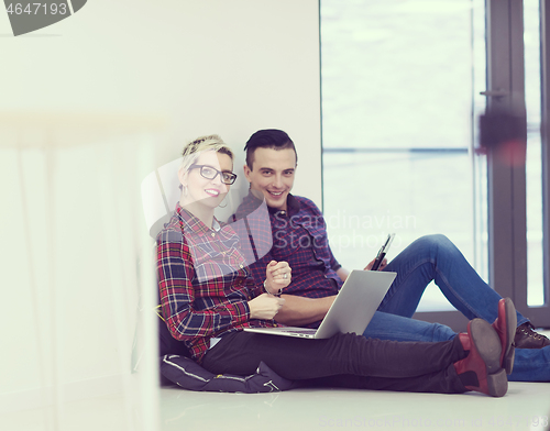 Image of startup business, couple working on laptop computer at office