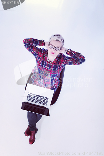 Image of top view of young business woman working on laptop computer