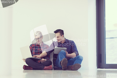 Image of startup business, couple working on laptop computer at office