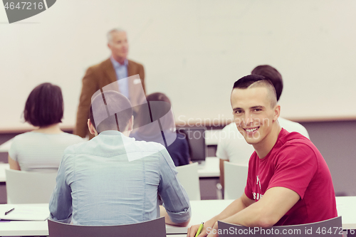 Image of technology students group in computer lab school  classroom