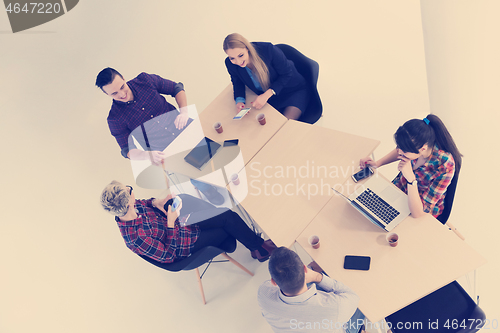 Image of aerial view of business people group on meeting