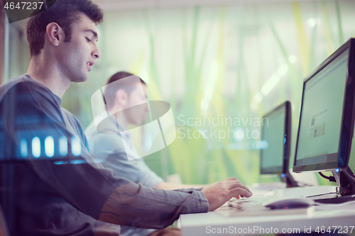 Image of technology students group working  in computer lab school  class