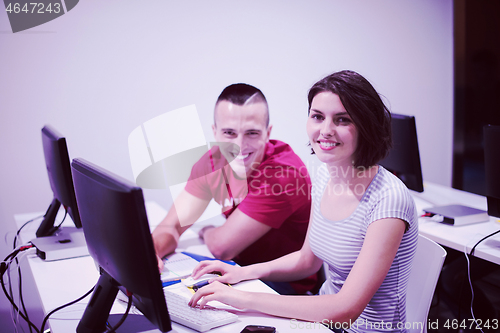 Image of technology students group working  in computer lab school  class