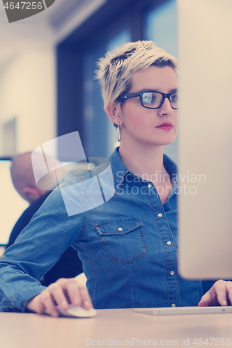 Image of startup business, woman  working on desktop computer