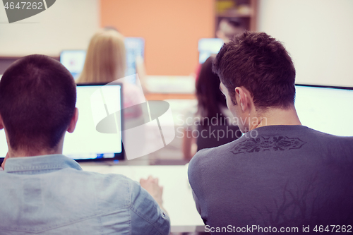 Image of technology students group working  in computer lab school  class
