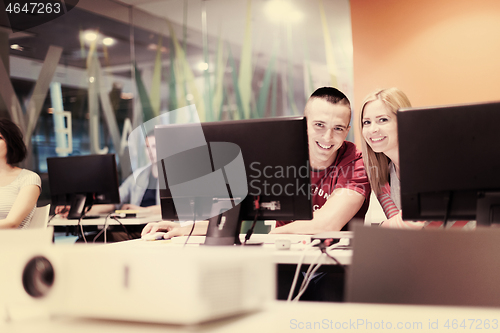 Image of technology students group in computer lab school  classroom