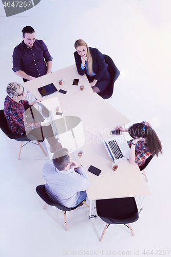 Image of aerial view of business people group on meeting