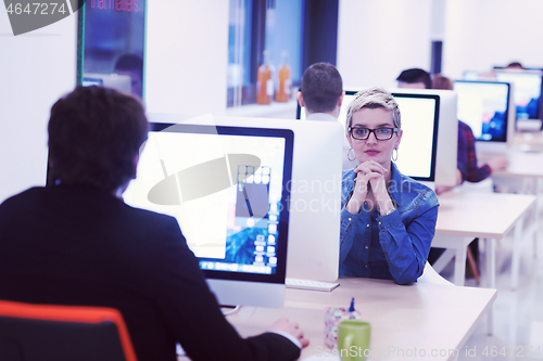 Image of startup business, woman  working on desktop computer