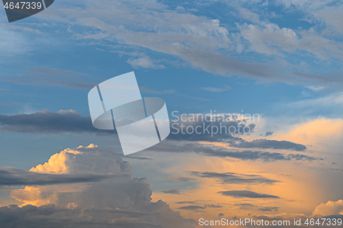 Image of Blue, yellow and orange sunset with clouds