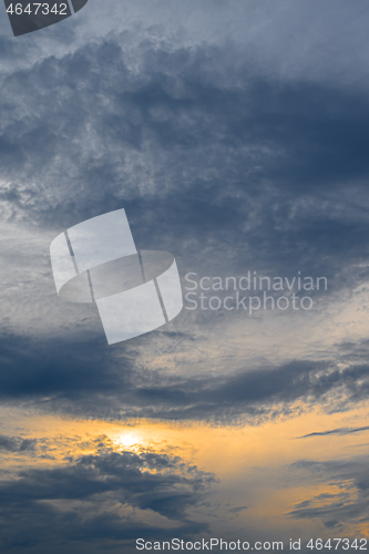 Image of Blue, yellow and orange sunset with clouds