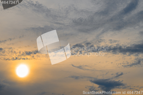 Image of Blue, yellow and orange sunset with clouds