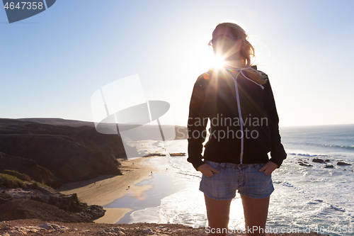 Image of Free happy woman winter vacation on La Pared beach, Fuerteventura, Canary Islands, Spain.