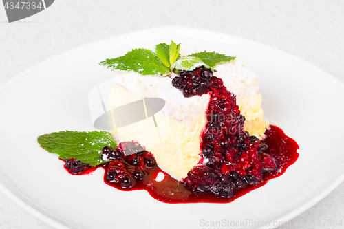 Image of Cremeschnitte with Berries Sauce and Green Mint.