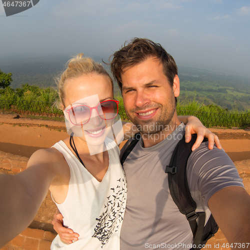 Image of Young beautiful couple making vacation selfie traveling at Sigiriya Fortres, Lion Rock, Sri Lanka