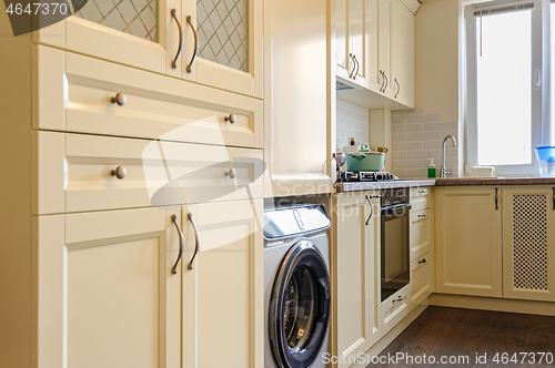 Image of modern cream colored kitchen interior