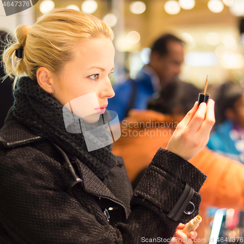 Image of Beautiful woman shopping in beauty store.