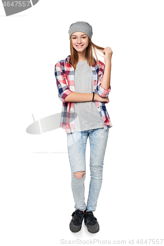 Image of Smiling relaxed teen girl standing in full length