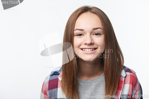 Image of Closeup of happy smiling teen girl looking at camera