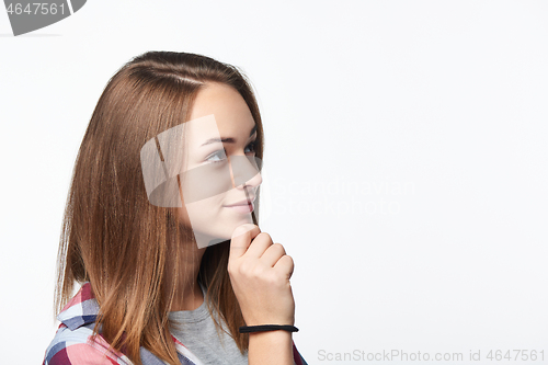 Image of Portrait of smiling teen girl looking at camera