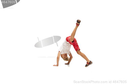 Image of Happy little caucasian boy jumping and running isolated on white background