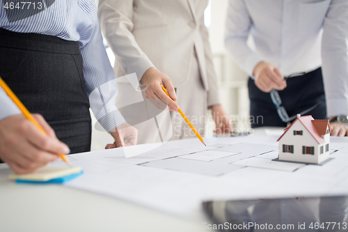 Image of close up of architects discussing house project