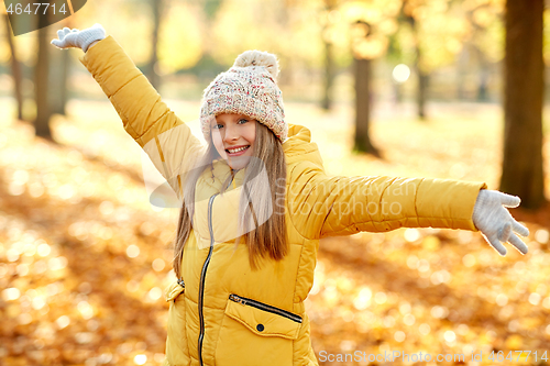 Image of happy girl at autumn park