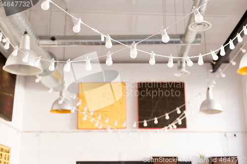 Image of close up of garland bulbs at modern restaurant