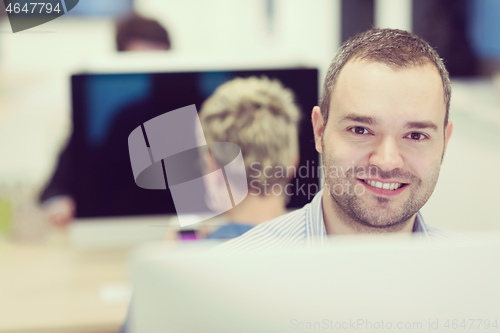 Image of startup business, software developer working on desktop computer