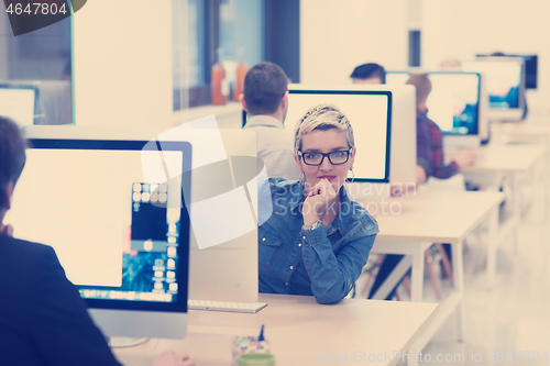 Image of startup business, woman  working on desktop computer