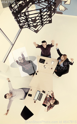 Image of aerial view of business people group on meeting