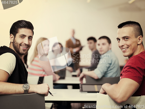 Image of teacher with a group of students in classroom