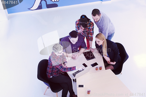 Image of aerial view of business people group on meeting