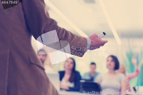 Image of close up of teacher hand while teaching in classroom