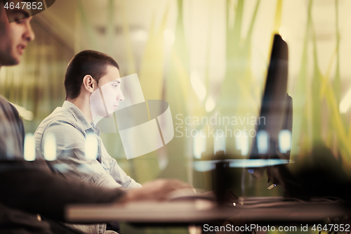 Image of technology students group working  in computer lab school  class