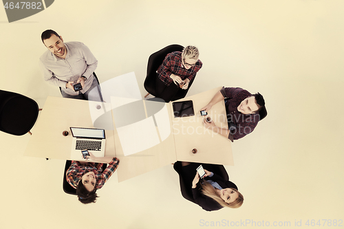 Image of aerial view of business people group on meeting