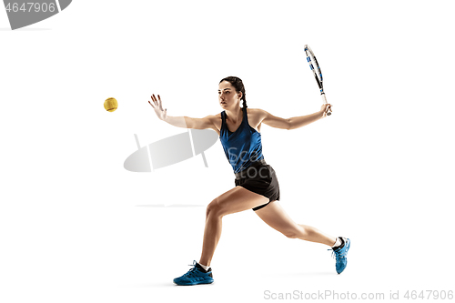 Image of Full length portrait of young woman playing tennis isolated on white background