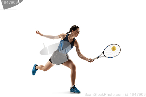 Image of Full length portrait of young woman playing tennis isolated on white background