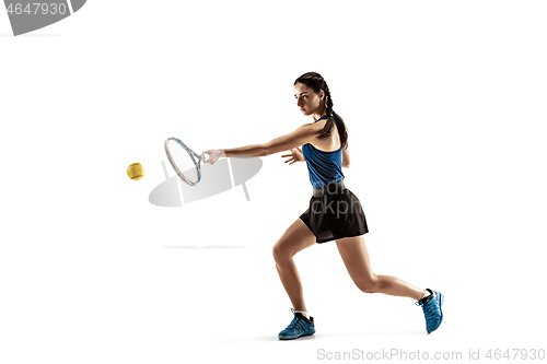 Image of Full length portrait of young woman playing tennis isolated on white background