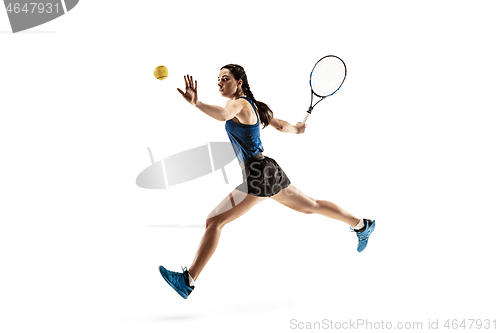 Image of Full length portrait of young woman playing tennis isolated on white background